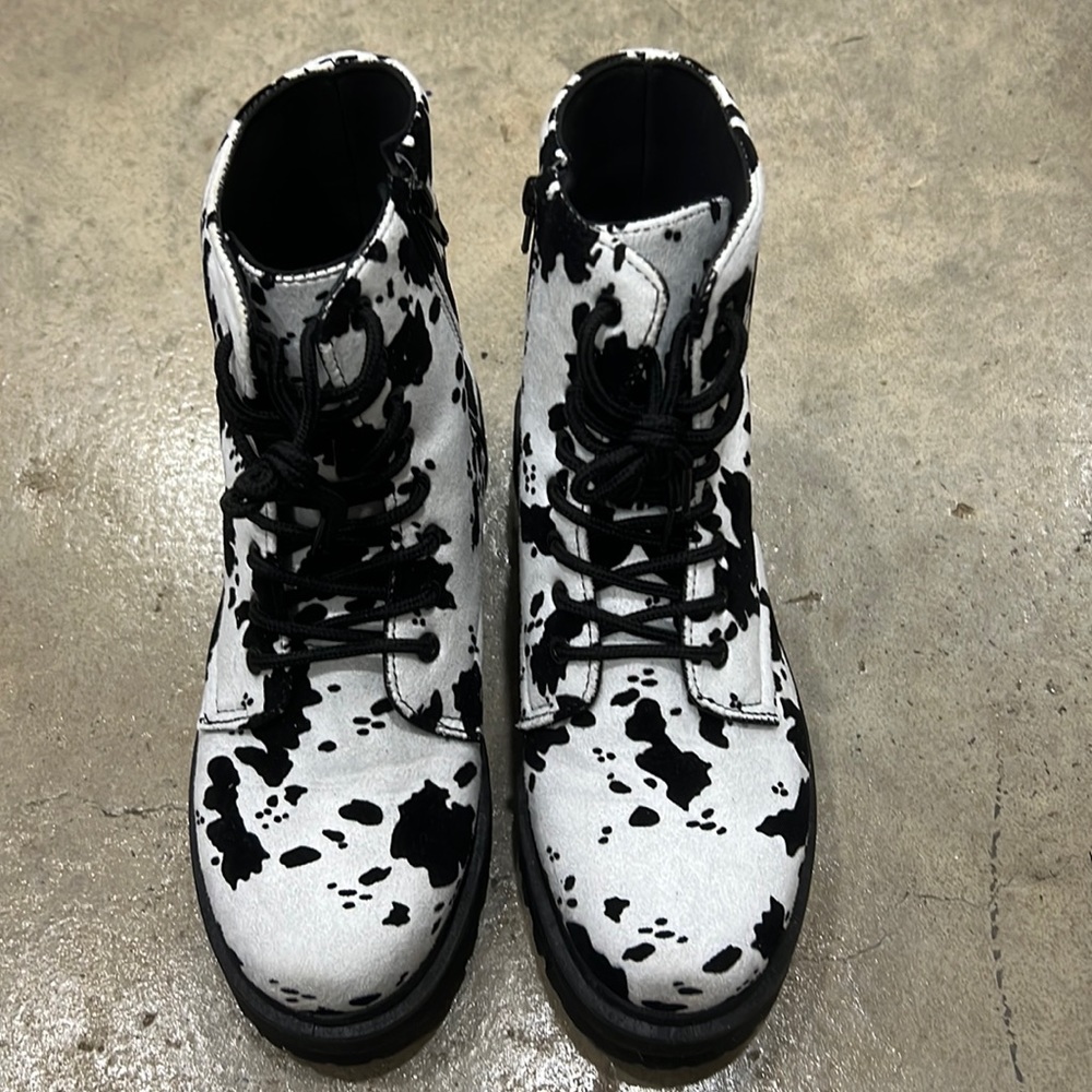 Cow print combat boots